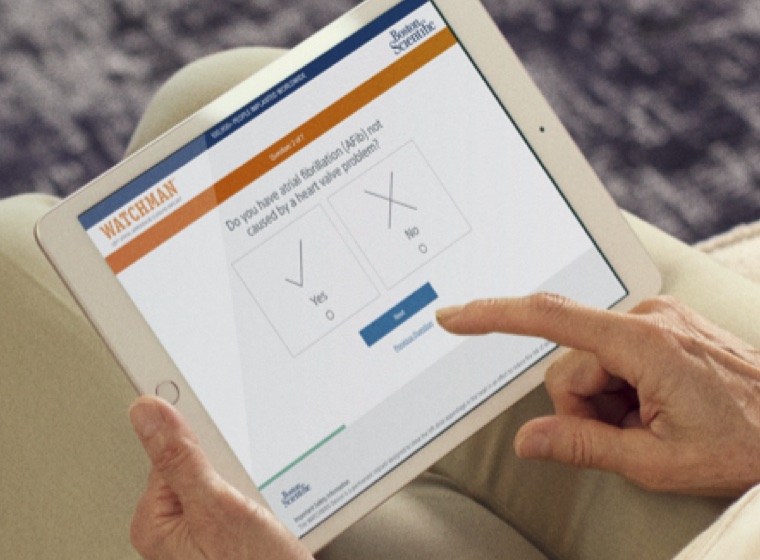 Finger pointing at WATCMAN resources on a tablet